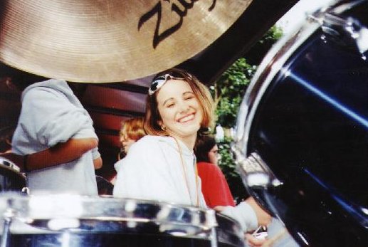 Leanne Bailey drumming and posing at the same time
